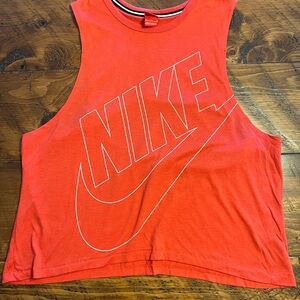 Nike women’s tank top in a beautiful coral red shade